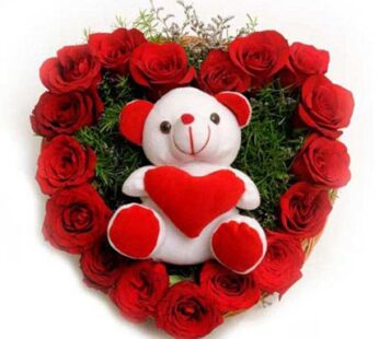 A heart shaped 50 red roses with cute teddy bear